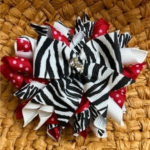 Red, white, pink, and zebra print Korker hair bow clip. Boutique quality style